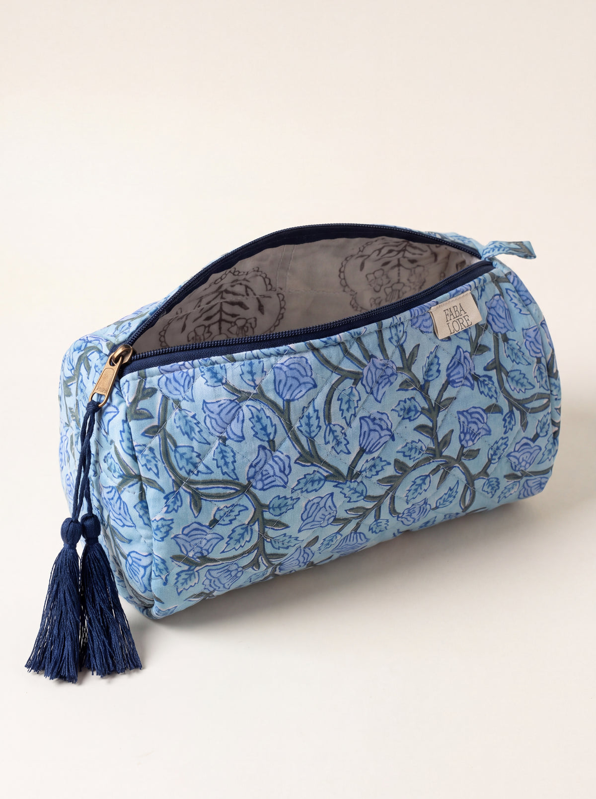 Open Fabalore Blue Bloom quilted floral pouch showing zip closure and lined interior.