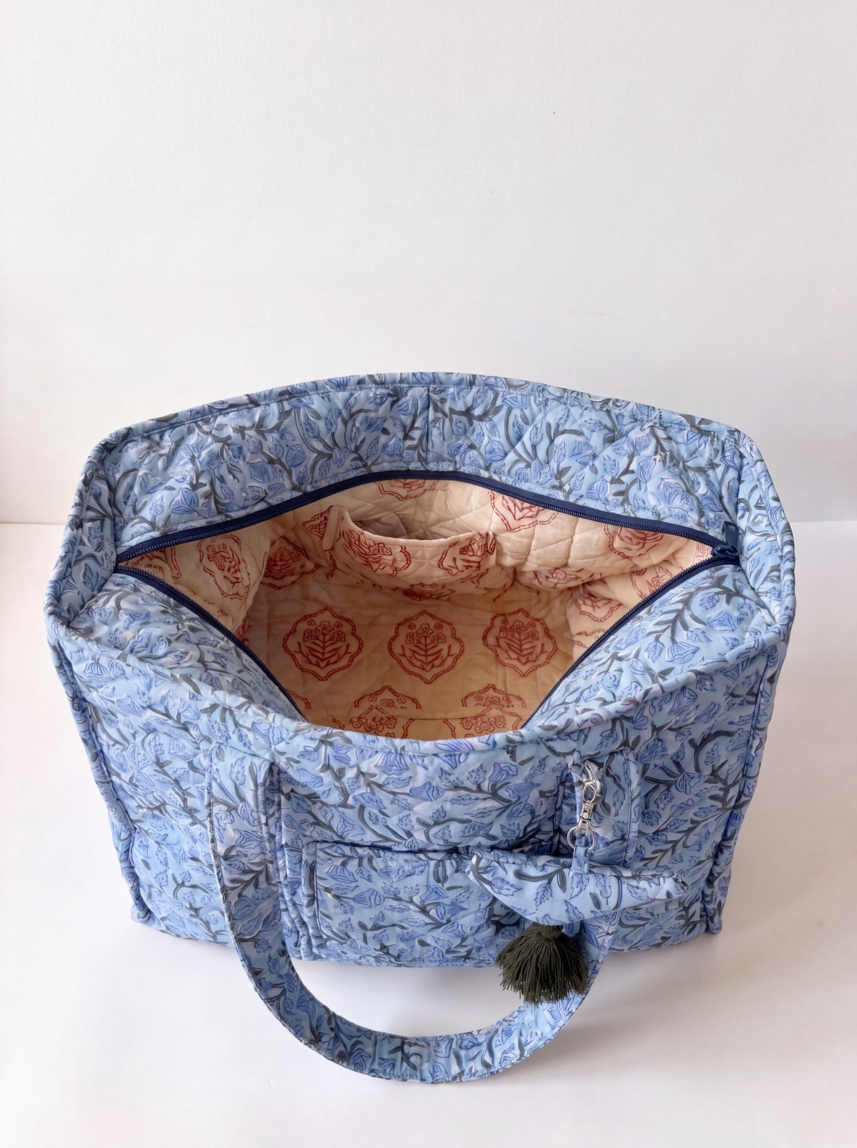 Open Blue Bloom quilted cotton tote showing zip closure and patterned cotton interior