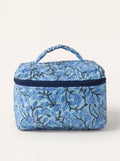 Fabalore Blue Bloom quilted vanity case with blue floral print, top handle and zip-around closure.