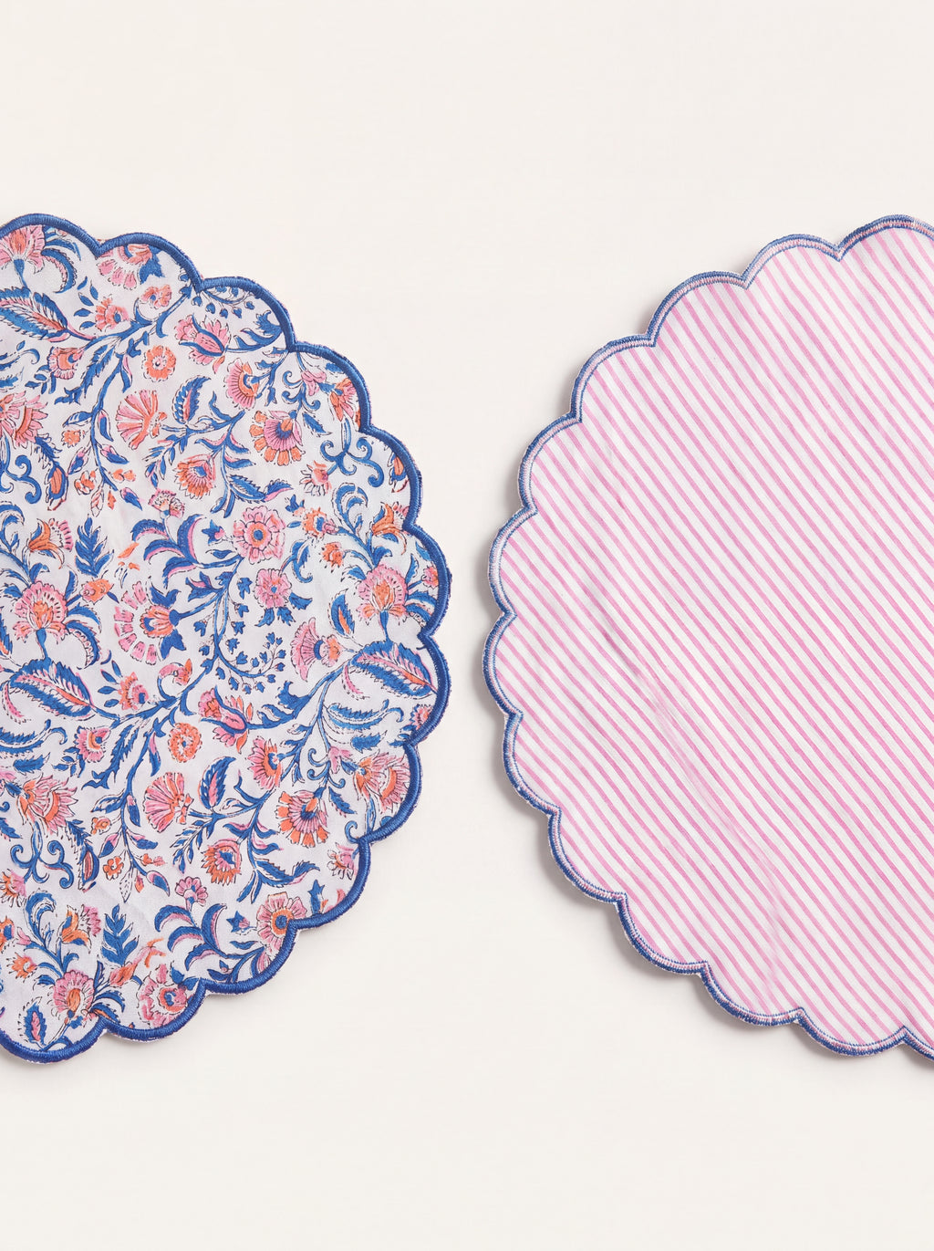 Front and reverse of Coral Garden quilted placemat showing floral print and pink striped backing