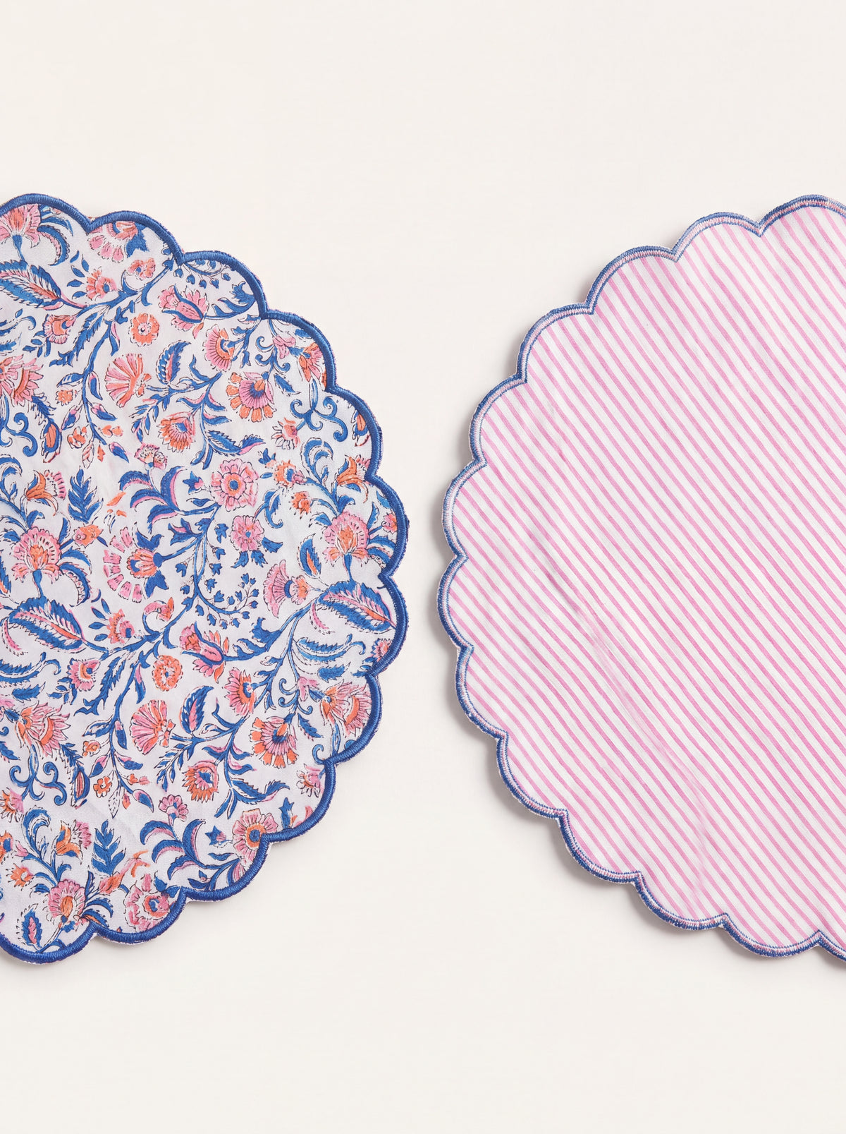 Front and reverse of Coral Garden quilted placemat showing floral print and pink striped backing