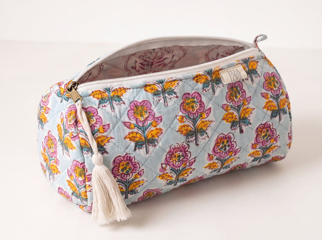 Open Fabalore Marigold Bloom quilted floral pouch showing zip closure and lined interior.