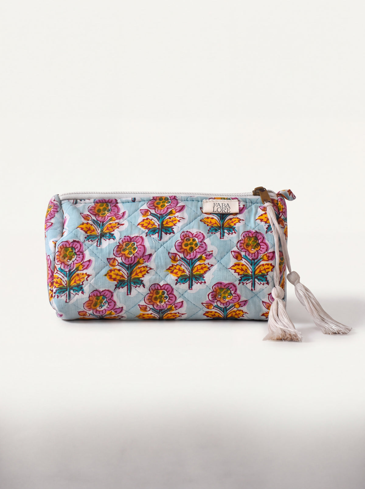 Small Fabalore Marigold Bloom quilted floral pouch with cream zipper and tassels.
