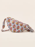 Fabalore Marigold Bloom quilted floral sling bag in light blue with pink and golden flowers.