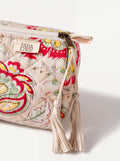 Close up of Fabalore Meadow quilted pouch showing floral fabric, zipper, logo label and cream tassels.
