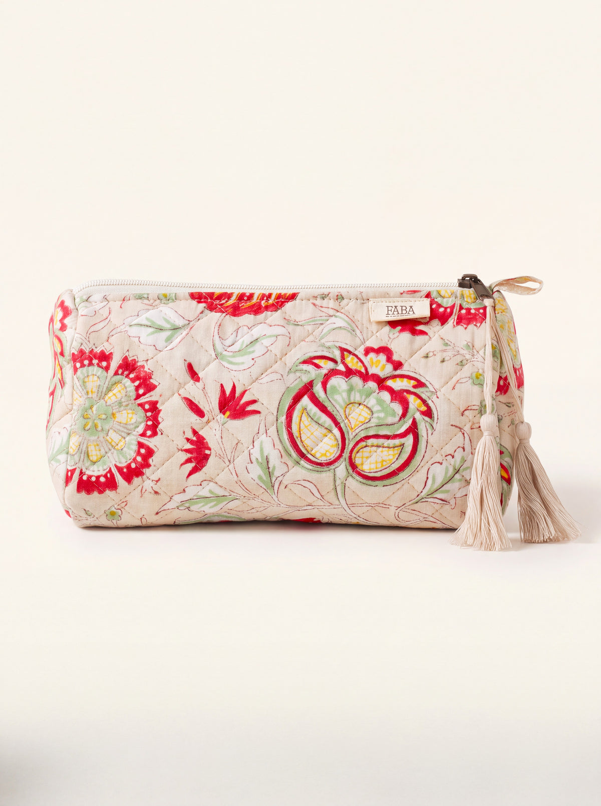 Medium Fabalore Meadow quilted floral pouch with cream zipper and tassel.