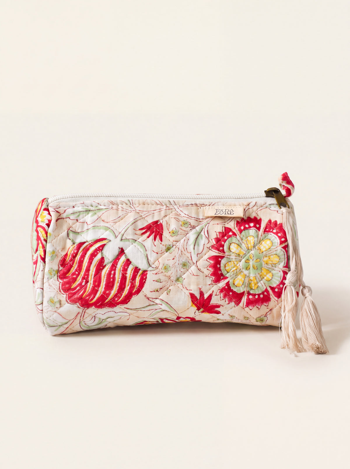 Small Fabalore Meadow quilted floral pouch with cream zipper and tassel.