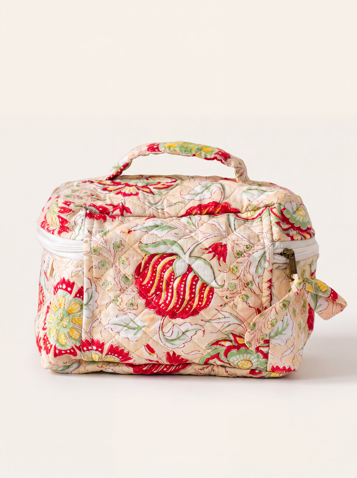 Fabalore Meadow quilted toiletry case showing floral print and structured rectangular shape.