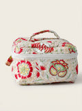 Fabalore Meadow quilted vanity case with floral print, zip-around closure and top handle.
