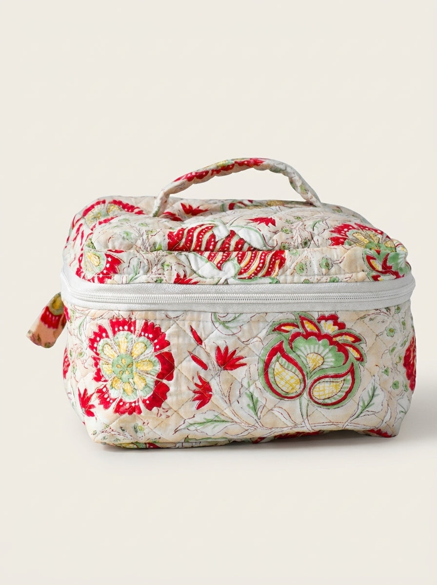 Fabalore Meadow quilted vanity case with floral print, zip-around closure and top handle.