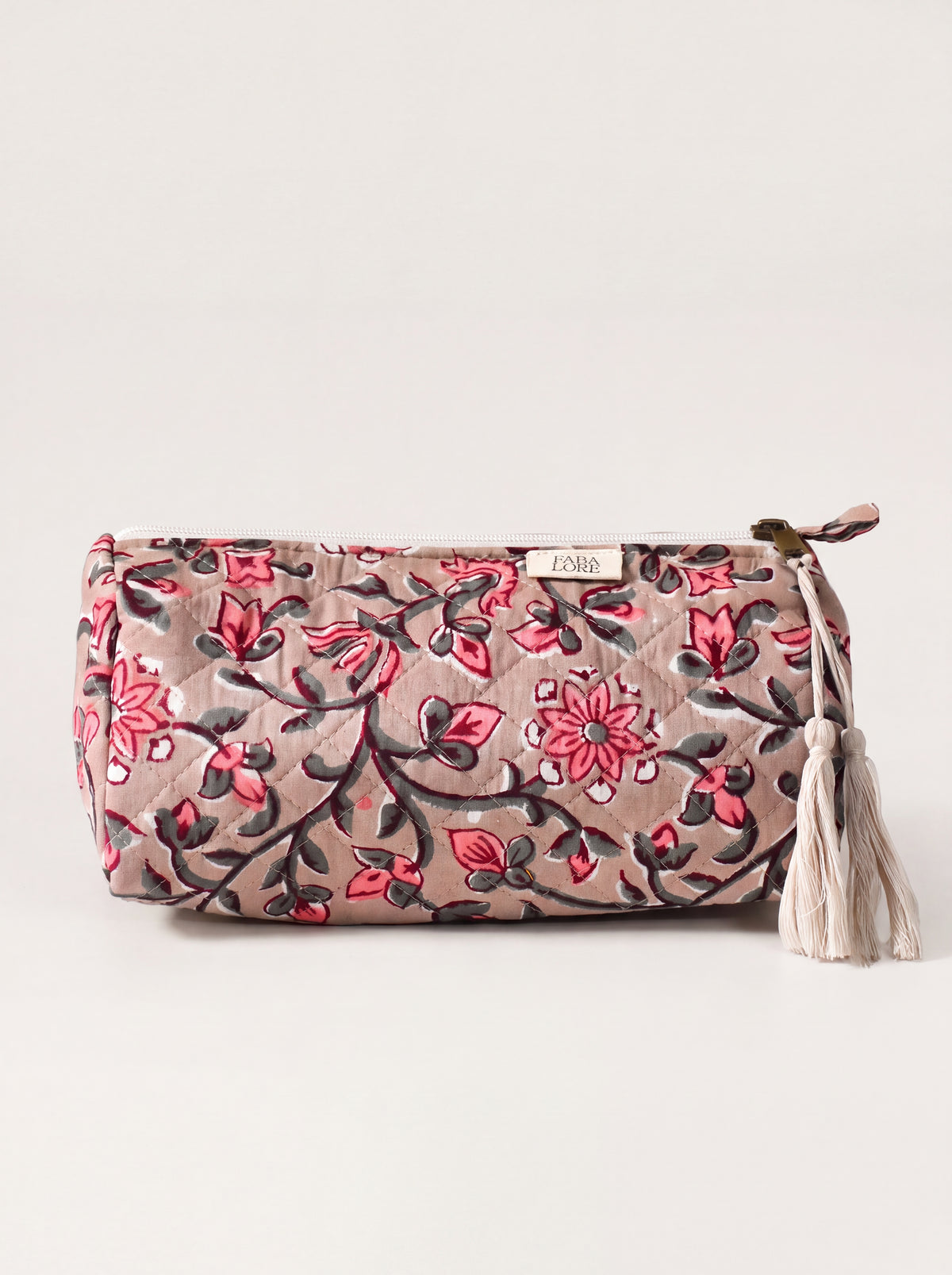 Medium Fabalore Rosewood quilted floral pouch with cream zipper and tassels.