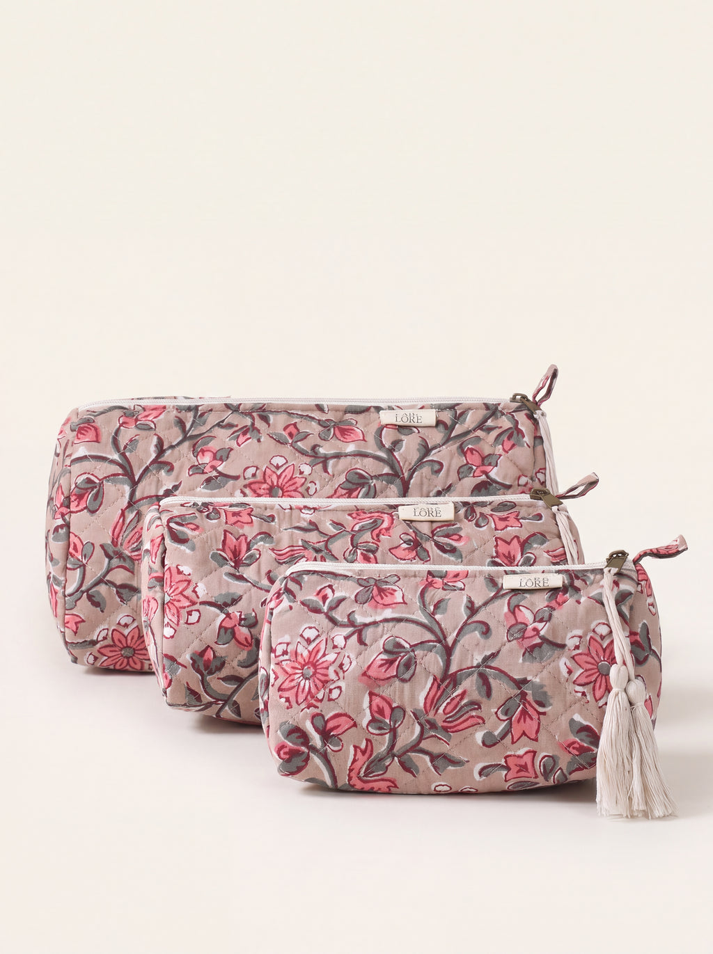 Three Fabalore Rosewood quilted floral pouches in small, medium and large sizes.