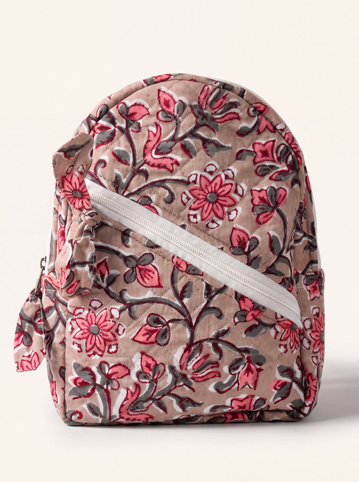 Rosewood quilted cotton backpack in taupe and pink floral print with diagonal front zip pocket.