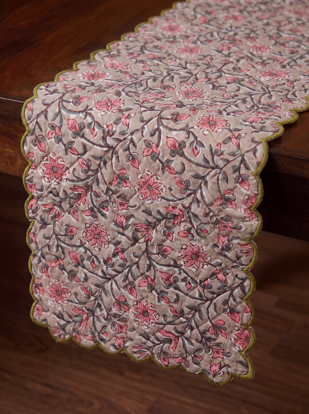 Close-up of Rosewood dusty pink and charcoal floral vine print on quilted cotton