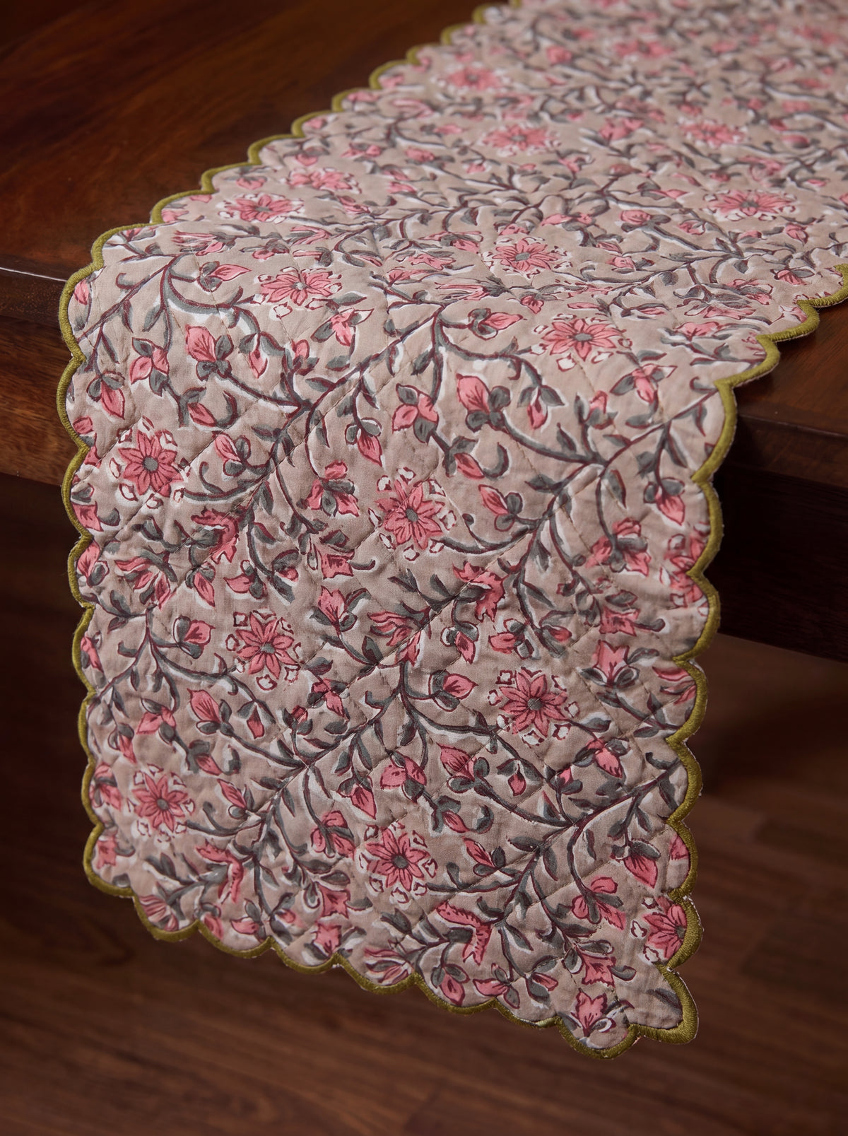 Close-up of Rosewood dusty pink and charcoal floral vine print on quilted cotton
