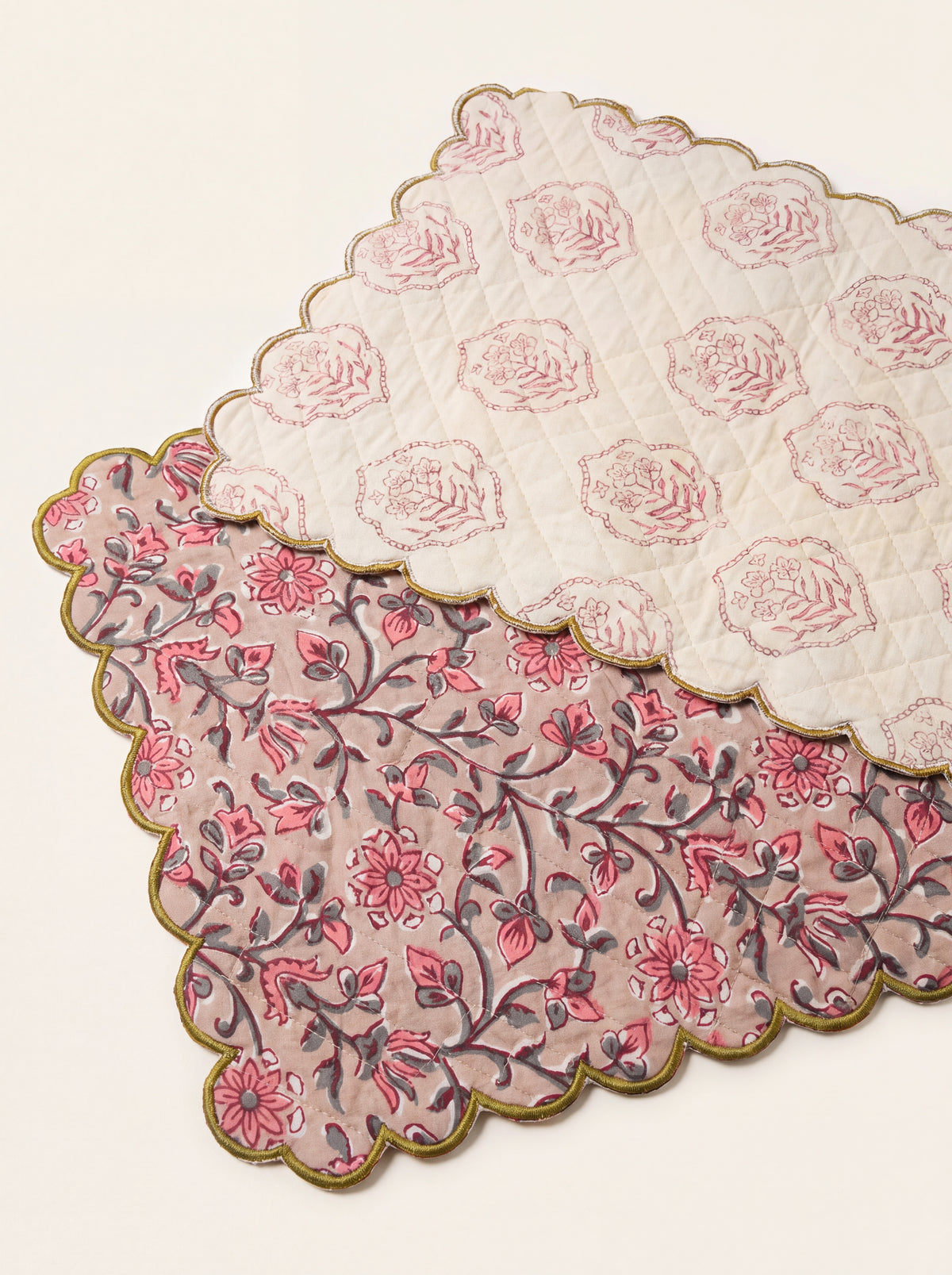 Reverse side of Rosewood quilted table runner with coordinating cream floral print and olive scalloped edge