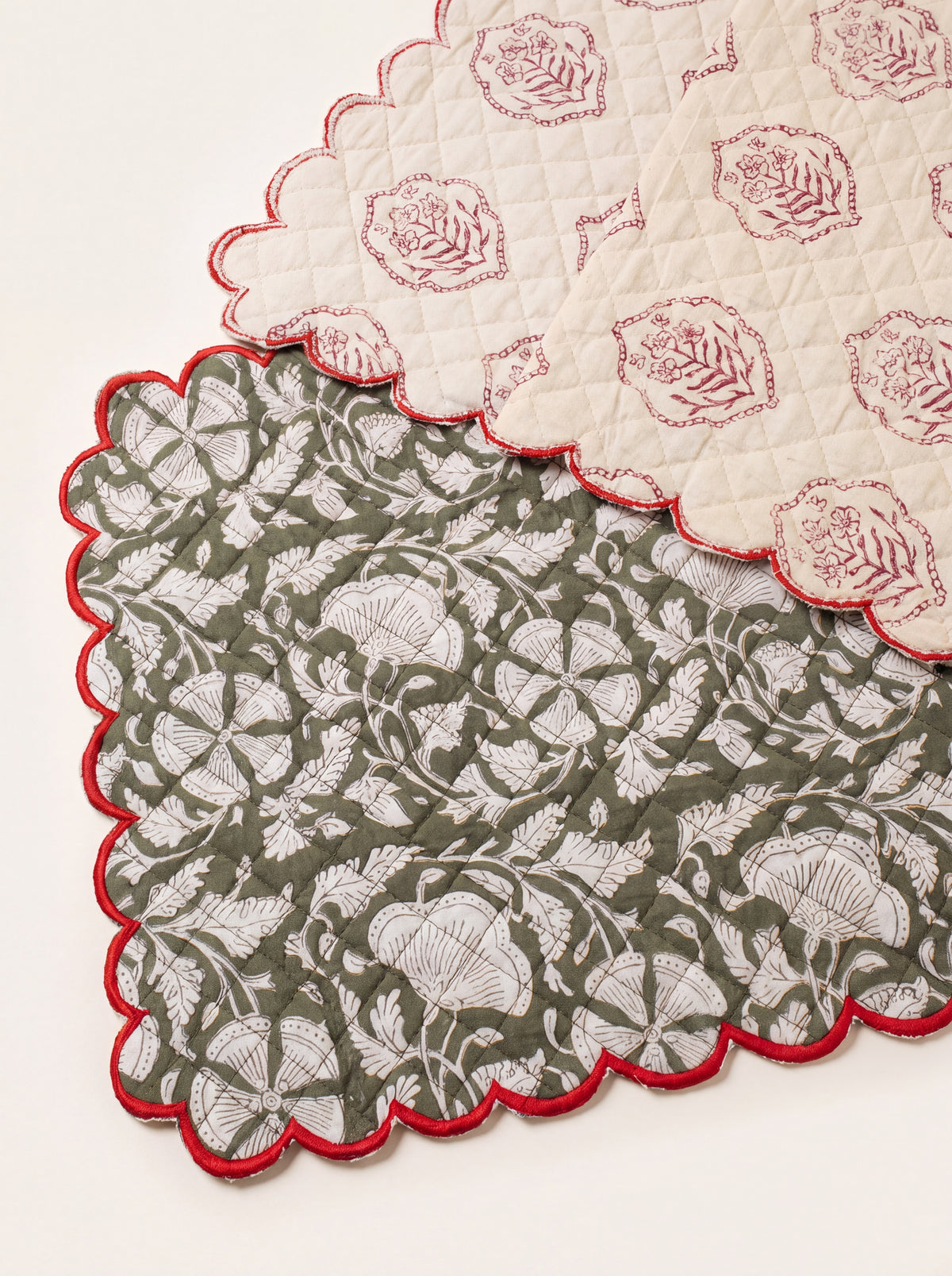 Woodland Vine table runner shown with coordinating cream floral reverse and red scalloped edging